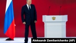 Russian President Vladimir Putin leaves the podium in Moscow's Manezh Central Exhibition Hall after delivering his annual state-of-the-nation speech on April 21, 2021. 