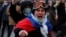 A man wearing a Russian flag shouts during a January 23, 2021 rally in St. Petersburg, Russia for the release of jailed Russian opposition leader Aleksei Navalny .