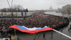 Holding placards declaring "I am not afraid," thousands of Russians marched in Moscow on March 1, 2015 to protest the assassination of Boris Nemtsov.