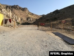 A metal gate bars entrance to the Shovvozsoy "vacation area"