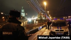 A police officer seen at the site of Russian opposition leader Boris Nemtsov's February 27, 2015 murder on Moscow's Bolshoi Moskvoretsky Bridge. 