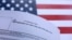 USA-U.S. flag and U.S. H-1B Visa application form are seen in this illustration taken September 26, 2025.
