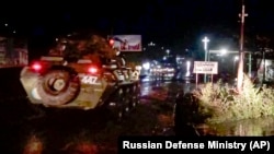 Russian military vehicles enter Stepanakert (Khankendi), the main town in the disputed region of Nagorno Karabakh, on November 12, 2020.